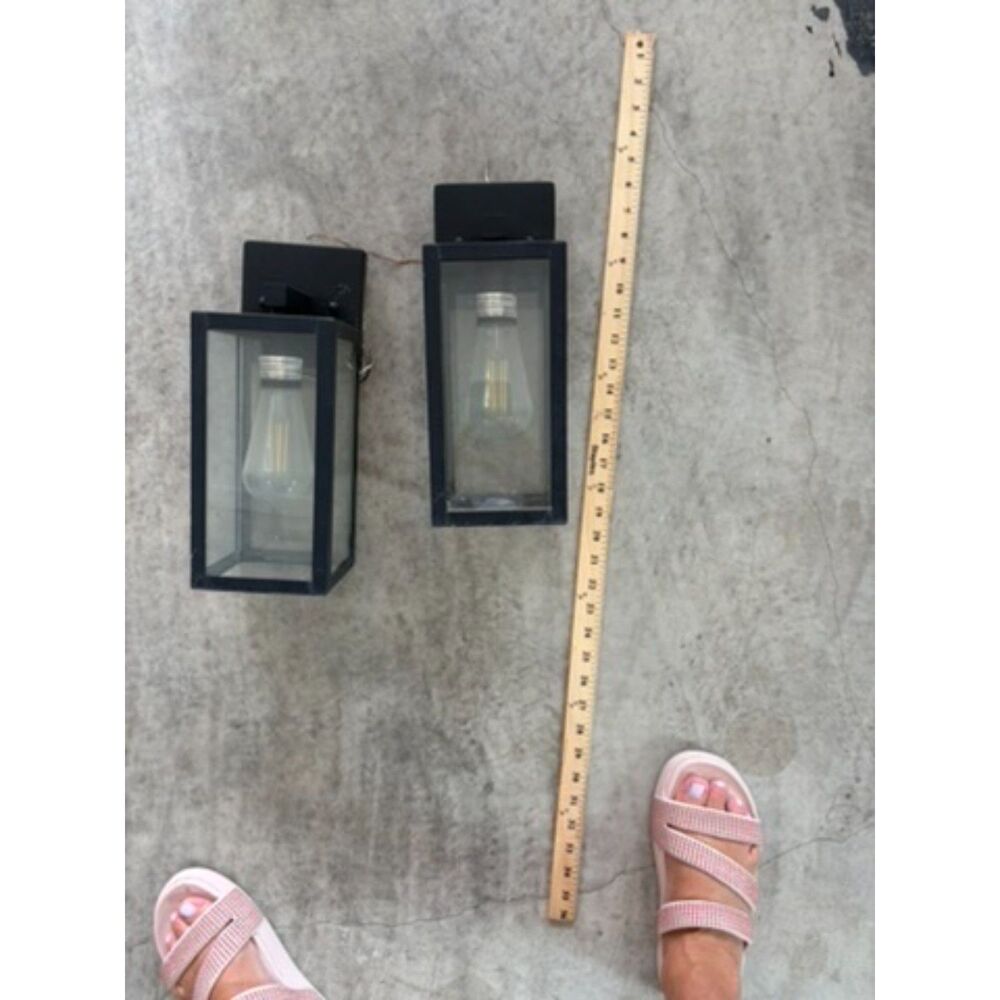 2 black outdoor lights 2 yrs old
